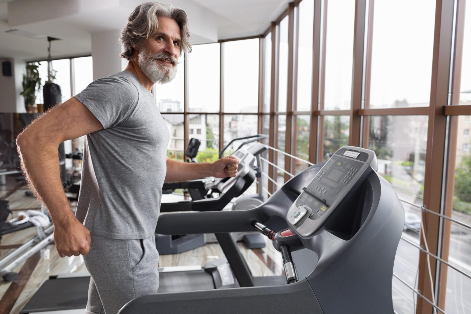side-view-man-running-treadmill